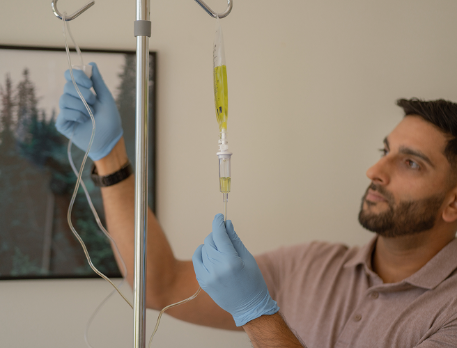 Dr. Nav Dhindsa setting up an IV bag